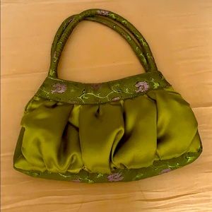 Green and pink silk formal bag